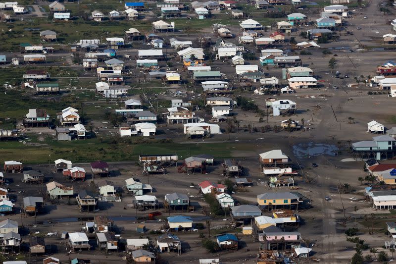 FILE PHOTO: A view shows debris and buildings damaged from Hurricane Ida during U.S. President Joe Biden's aerial tour of communities in Laffite, Grand Isle, Port Fourchon