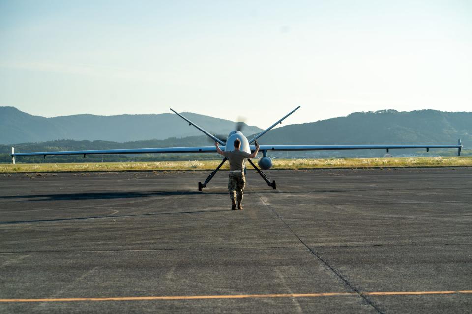 A MQ-9 Reaper drone on a landing strip in Japan