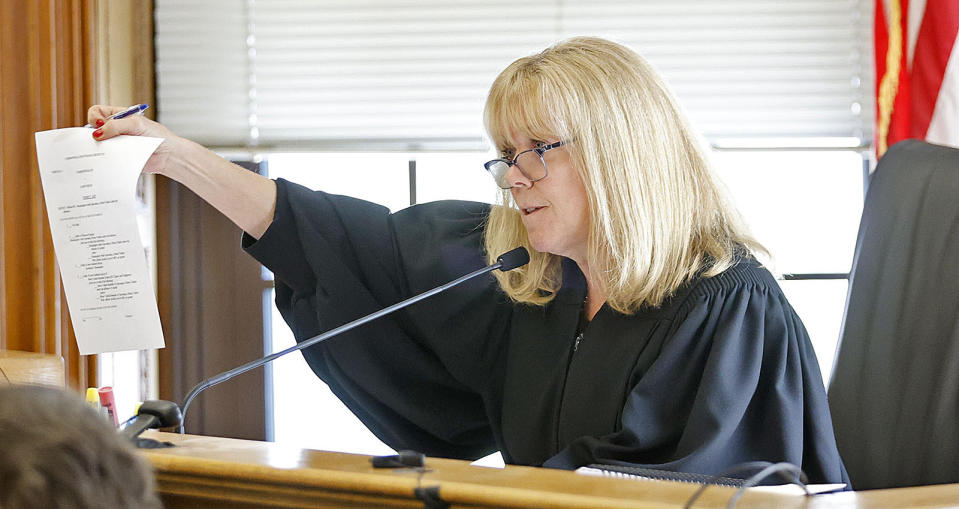 Judge Beverly Cannone looks over the verdict slip the jurors have to fill out when they reach a verdict in Karen Read's murder trail, Wednesday June 26, 2024, at Norfolk Superior Court in Dedham, Mass. The defense has asked for some modifications. Read is charged with second-degree murder in the January 2022 death of her boyfriend Boston Police Officer John O’Keefe. (Greg Derr/The Patriot Ledger via AP, Pool)