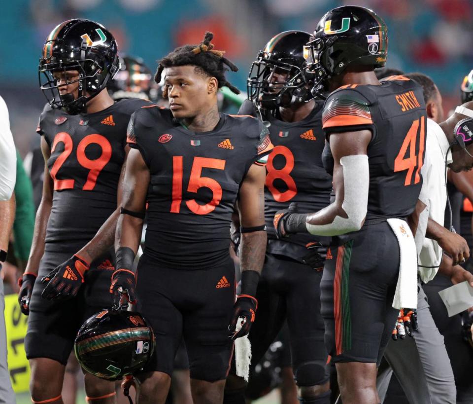 Miami Hurricanes safety Avantae Williams (15) joins teammates on the field during game against the North Carolina State Wolfpack at Hard Rock Stadium in Miami Gardens on Saturday, October 23, 2021. Cornerback Isaiah Dunson (29) will be converted to safety after a season-ending injury to starter Bubba Bolden.