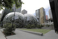 The usually busy dog walking area near the Amazon Spheres is empty of people and pets, Thursday, April 30, 2020, in downtown Seattle. Amazon.com is expected to announce earnings for the first quarter of 2020 at the close of markets Thursday, a report that is expected to be closely watched due to the effects of the coronavirus outbreak on the company. (AP Photo/Ted S. Warren)