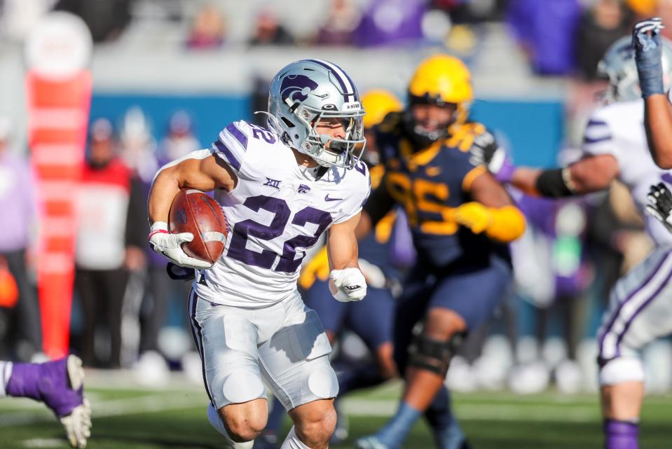 Kansas State running back Deuce Vaughn (22) runs 15 yards for the Wildcats' first touchdown Saturday against West Virginia at Milan Puskar Stadium in Morgantown, West Va.