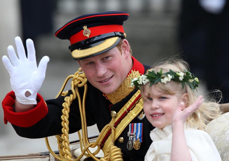 Prince Harry waves to the crowds with Louise after the Cambridges’ wedding (Steve Parsons/PA) (PA Archive)