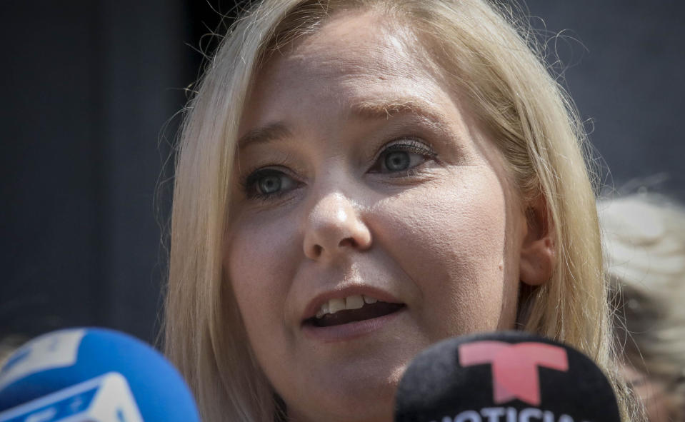 Virginia Roberts Giuffre, a sexual assault victim, speak during a press conference outside a Manhattan court where sexual victims, on invitation of a judge, addressed a hearing after the accused Jeffrey Epstein killed himself before facing sex trafficking charges, Tuesday Aug. 27, 2019, in New York. (AP Photo/Bebeto Matthews)