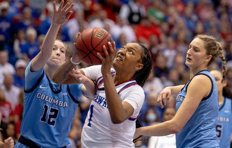 Kansas center Taiyanna Jackson (1) goes up against Columbia forward Hannah Pratt (12) during the second half of an NCAA college basketball game in the final of the WNIT, Saturday, April 1, 2023, in Lawrence, Kan.