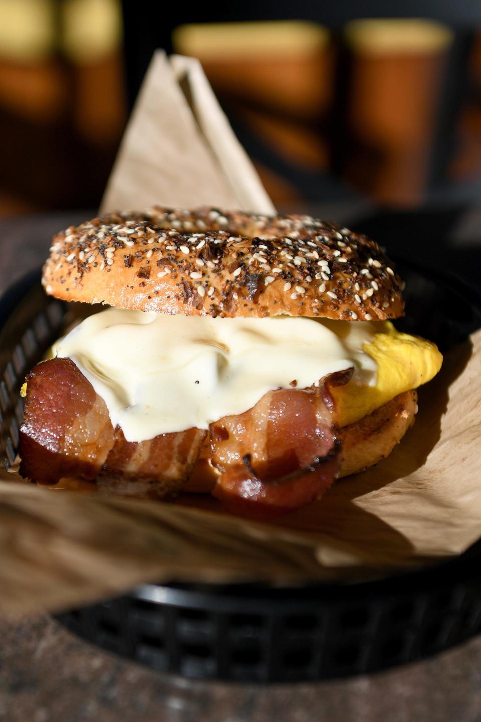 A sandwich with bacon, egg and cheese is created with a house-made bagel at Ziggy&#39;s Deli &amp; Bakery. 