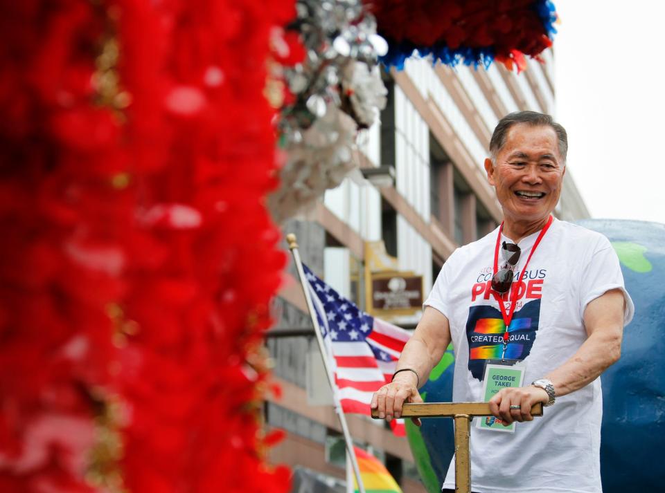 George Takei rides on a float while appearing as the Grand Marshal of the Stonewall Columbus Pride Parade in downtown Columbus on Saturday, June 21, 2014.
