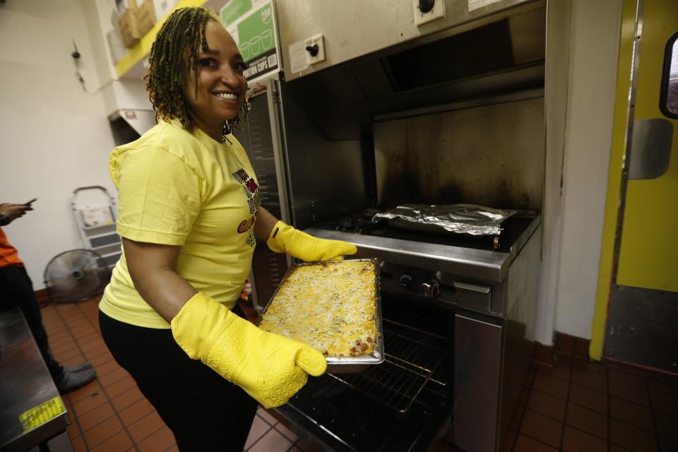 Ayesha Collier is the owner of Sun of a Vegan. They are located in the food court section of the Hickory Ridge Mall in Memphis. She pulls out a lasagna from the oven. 