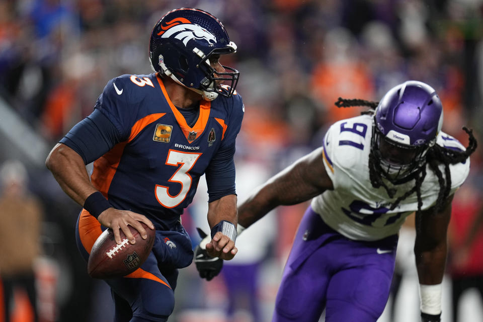 Denver Broncos quarterback Russell Wilson (3) scrambles against the Minnesota Vikings during the first half on an NFL football game, Sunday, Nov. 19, 2023, in Denver. (AP Photo/Jack Dempsey)