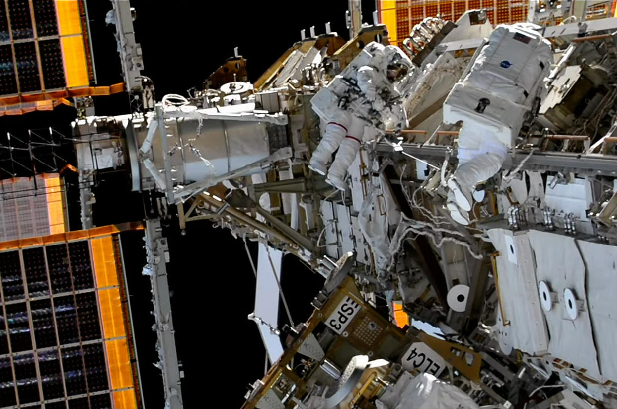  NASA astronaut Nicole Mann (at left) and Koichi Wakata of the Japan Aerospace Exploration Agency (JAXA) perform a spacewalk outside of the International Space Station on Thursday, Feb. 2, 2023. 