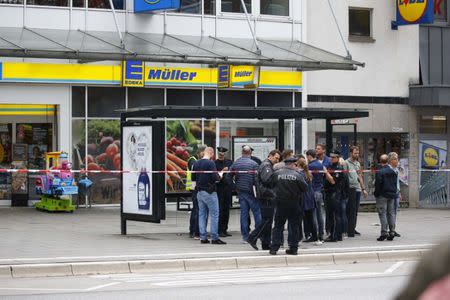 Security forces are seen after a knife attack in a supermarket in Hamburg, Germany, July 28, 2017. REUTERS/Morris Mac Matzen