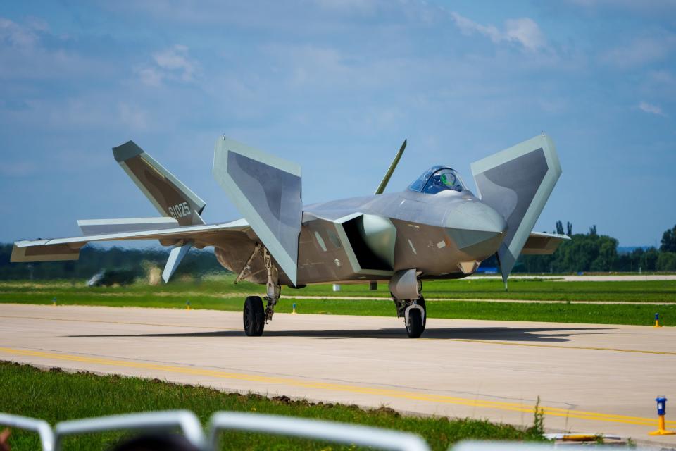 A J-20 stealth fighter jet is seen on a runway while rehearsing for an air show.