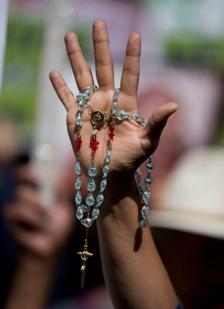 A pro-life activist holds a rosary outside Mexico's Supreme Court during a hearing over a controversial abortion case in Mexico City in June 2016. Abortion was illegal in Mexico for most of the 20th century, but reproductive rights advocates have been making incremental steps in the last two decades toward winning abortion access in the heavily Catholic country.