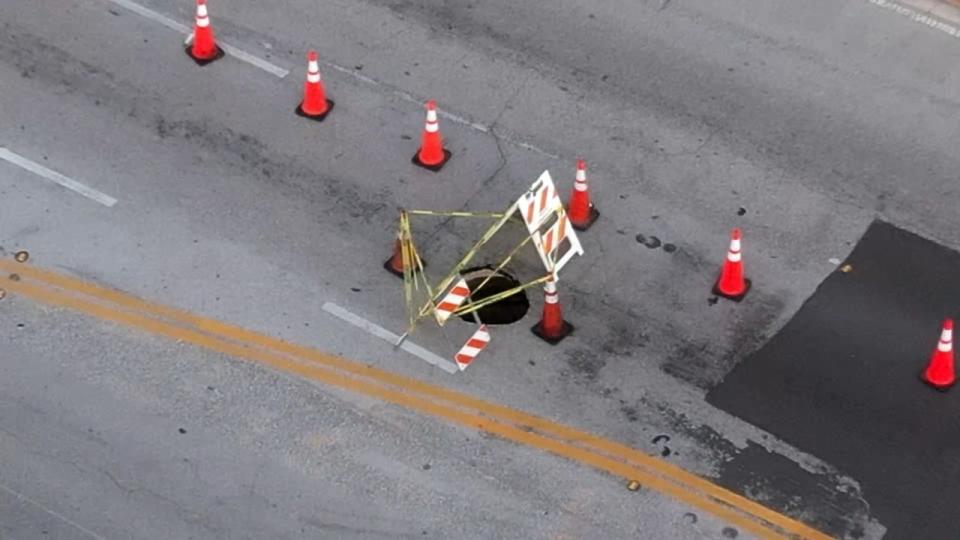 A hole opened in the road Thursday night in Orlando's busy SODO district.