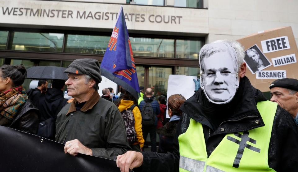 Those supporting Julian Assange, right, were outside court as the WikiLeaks founder appeared in the dock (AP)