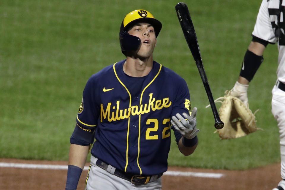 Milwaukee Brewers' Christian Yelich tosses his bat as he walks back to the dugout after striking out looking against Pittsburgh Pirates relief pitcher Robbie Erlin during the seventh inning of a baseball game in Pittsburgh, Wednesday, July 29, 2020. (AP Photo/Gene J. Puskar)