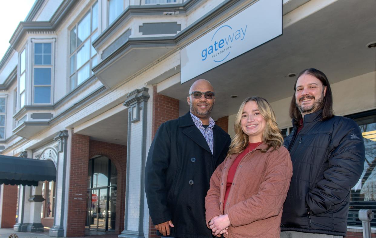 Program director Winston Henry, left, recovery coach Paiton Fornoff, middle, and clinical supervisor Brandon Underwood stand in front of the entrance to the Gateway Foundation, an outpatient drug and alcohol abuse counseling center in the Arcade Building at 11 S. Capitol Street in downtown Pekin.