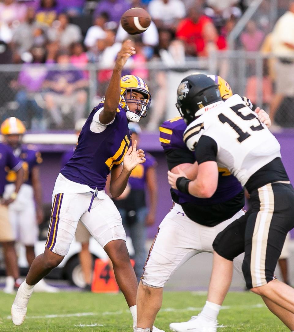 Columbia High School quarterback Zaccheus Paulk (11) passes in the first half. The Columbia Tigers hosted the Buchholz Bobcats at Columbia High School in Lake City, FL on Friday, August 25, 2023. Buchholz lead 14-0 after the first quarter. [Doug Engle/Ocala Star Banner]