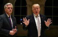 US President Donald Trump (R) speaks beside House Majority Leader Kevin McCarthy (L) at Trump International Golf Club in West Palm Beach on January 14, 2018