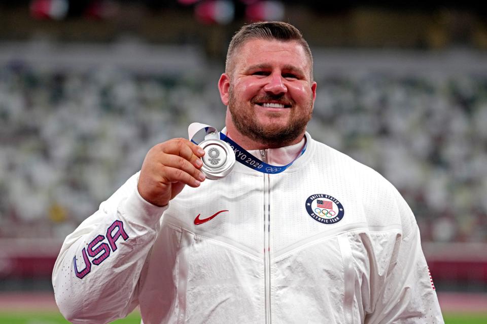 Aug 5, 2021; Tokyo, Japan; Joe Kovacs (USA) celebrates winning the silver medal men's shot put during the Tokyo 2020 Olympic Summer Games at Olympic Stadium. Mandatory Credit: Kirby Lee-USA TODAY Sports