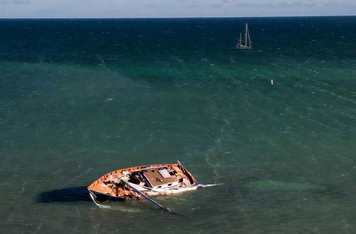 A vessel used by Haitian migrants sits stuck in a sandbar off the coast of Islamorada in the Florida Keys on Jan. 14, 2023.