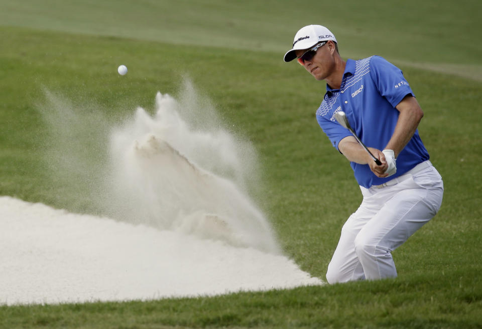 John Senden, of Australia, hits from a bunker on the 11th hole during the third round of The Players championship golf tournament at TPC Sawgrass, Saturday, May 10, 2014, in Ponte Vedra Beach, Fla. (AP Photo/John Raoux)