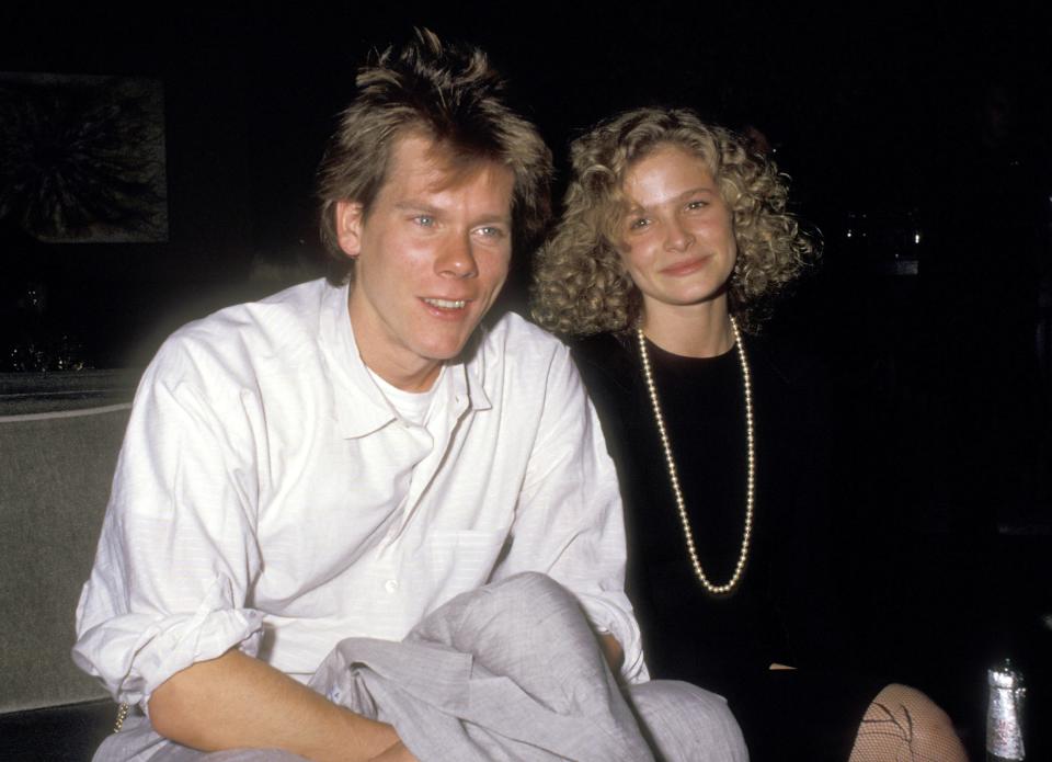 Kevin Bacon sitting next to Kyra Sedgwick