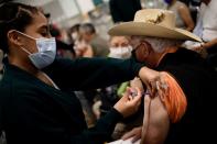 Senior citizens receive third dose of vaccine against the coronavirus disease (COVID-19), in Mexico City