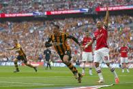 Hull City's Curtis Davies (L) celebrates after scoring his team's second goal as Arsenal's Kieran Gibbs looks on during their FA Cup final soccer match at Wembley Stadium in London, May 17, 2014. REUTERS/Darren Staples (BRITAIN - Tags: SPORT SOCCER)