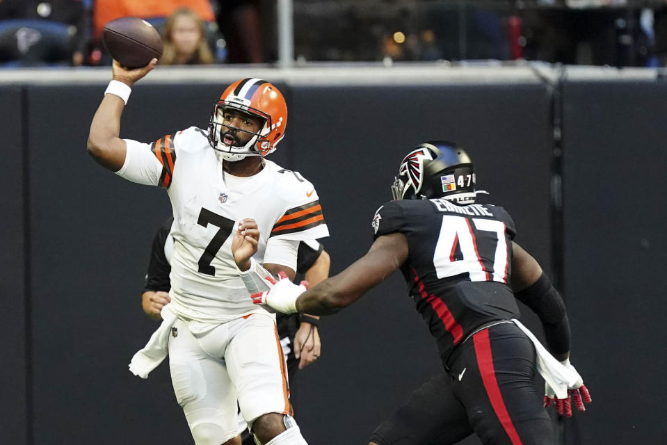 Cleveland Browns quarterback Jacoby Brissett (7) throws under pressure from Atlanta Falcons defensive end Arnold Ebiketie (47) during the first half of an NFL football game, Sunday, Oct. 2, 2022, in Atlanta. (AP Photo/John Bazemore)