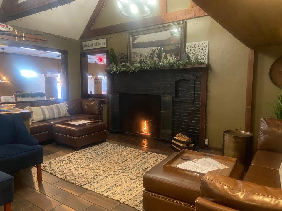 Take a seat near the fireplace at the Horseshoe Pub in Hudson