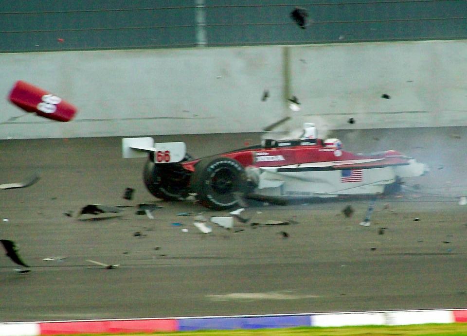 FILE - In this Sept. 15, 2001, file photo, Italian driver Alex Zanardi's car breaks up after it crashed with Canadian driver Alex Tagliani during the CART auto race at the Eurospeedway Lausitz in Klettwitz, eastern Germany. Zanardi never complained, not even in the immediate moments after he awoke in a hospital room in Germany without his legs. (AP Photo/Eckehard Schulz, File)