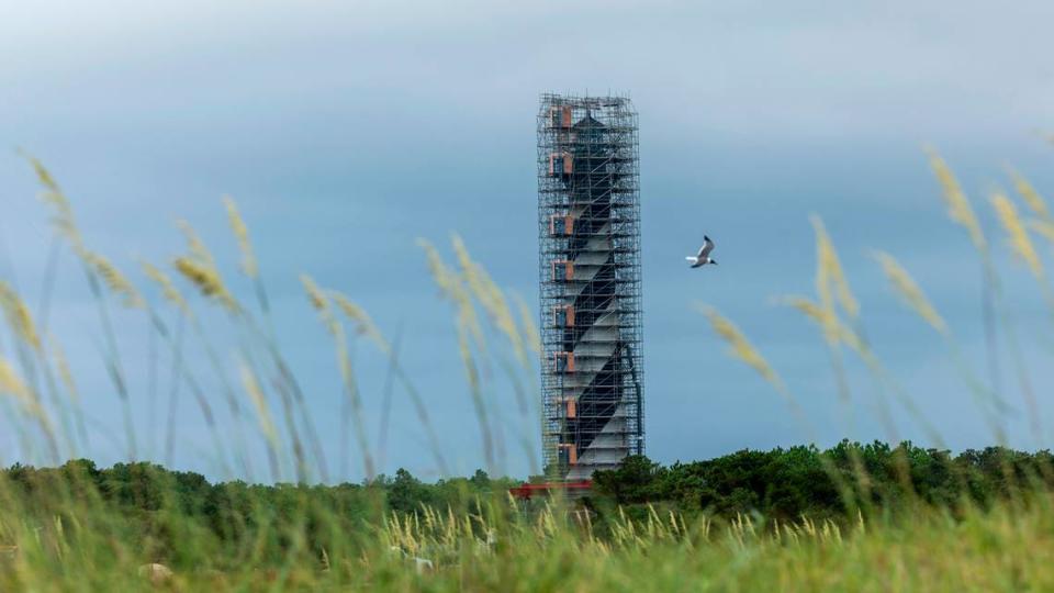 The Cape Hatteras Lighthouse is surrounded by scaffolding as it undergoes restoration on Monday, July 1, 2024. The project is expected to cost $19.2 million and will include replacing 40,000 of its estimated 1,250,000 bricks, replacing rusted or broken metal components and the installation of a near-exact replica of the first-order Fresnel lens.