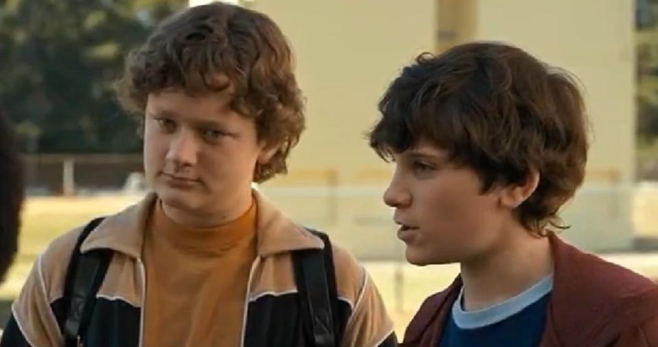 Troy and James talking to Mike, Dustin, and Lucas in "Stranger Things"