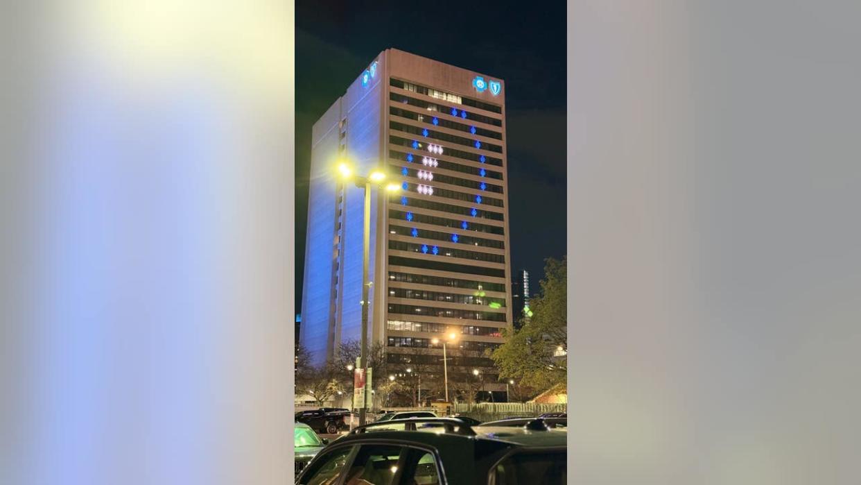 <div>The Blue Cross Blue Shield of Michigan Tower at 600 E. Lafayette in Detroit sporting a Honolulu Blue football and lights as the city prepares to host the NFL Draft. The building will be lit up through April 28. (Photo by John Burr/Fox2)</div>