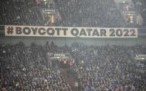A banner reads "boycott Qatar 2022" on the tribune during the German Bundesliga soccer match between FC Schalke 04 and Bayern Munich in Gelsenkirchen, Germany, Saturday, Nov. 12, 2022. (AP Photo/Martin Meissner)
