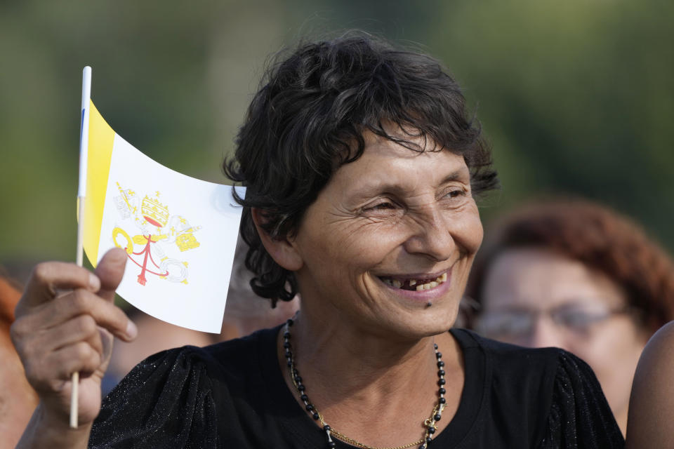 A resident waits for Pope Francis arrival to meet members of the Roma community at Lunik IX, in Kosice, Slovakia, Tuesday, Sept. 14, 2021, the biggest of about 600 shabby, segregated settlements where the poorest 20% of Slovakia's 400,000 Roma live. Pope Francis traveled to Kosice, in the far east of Slovakia on Tuesday to meet with the country's Roma in a gesture of inclusion for the most socially excluded minority group in Slovakia, who have long suffered discrimination, marginalization and poverty. (AP Photo/Gregorio Borgia)