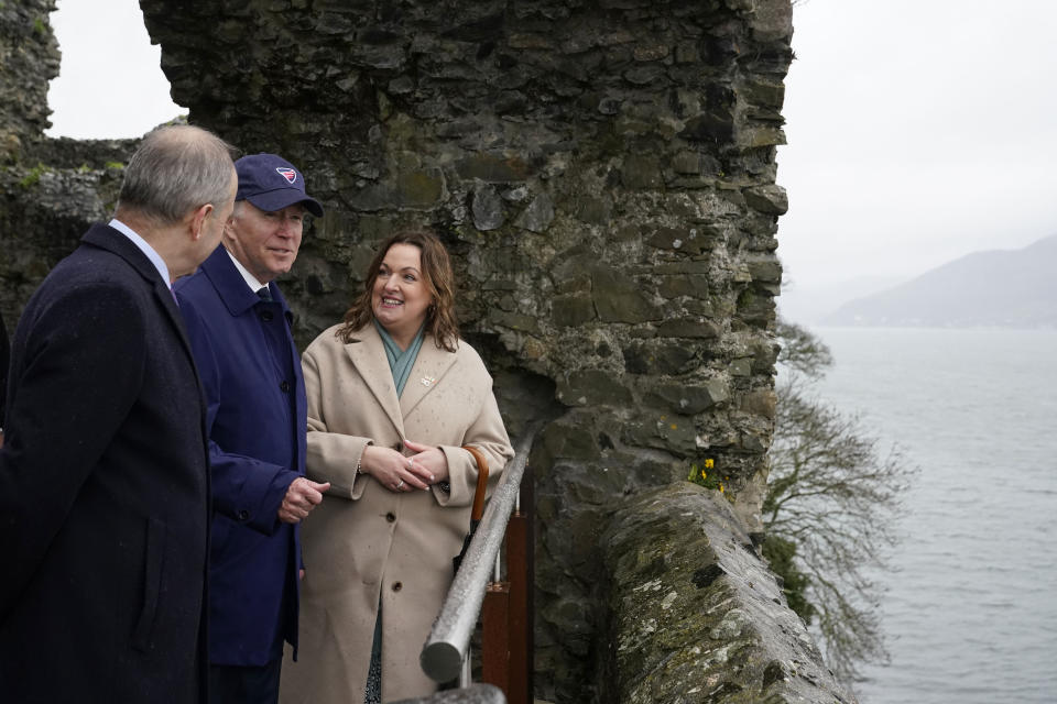 President Joe Biden speaks with Micheál Martin, Tánaiste of Ireland, left, and Yvonne Keenan-Ross, project manager for Carlingford Heritage Trust and Tourism, during a tour of Carlingford Castle in County Louth, Ireland, Wednesday, April 12, 2023. (AP Photo/Patrick Semansky)