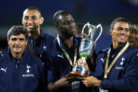 Tottenham Hotspur's Ledley King (center) and Jermaine Jenas hold aloft the Port of Rotterdam Tournament trophy as manager Juande Ramos (left) looks on (Photo by Barrington Coombs - PA Images via Getty Images)