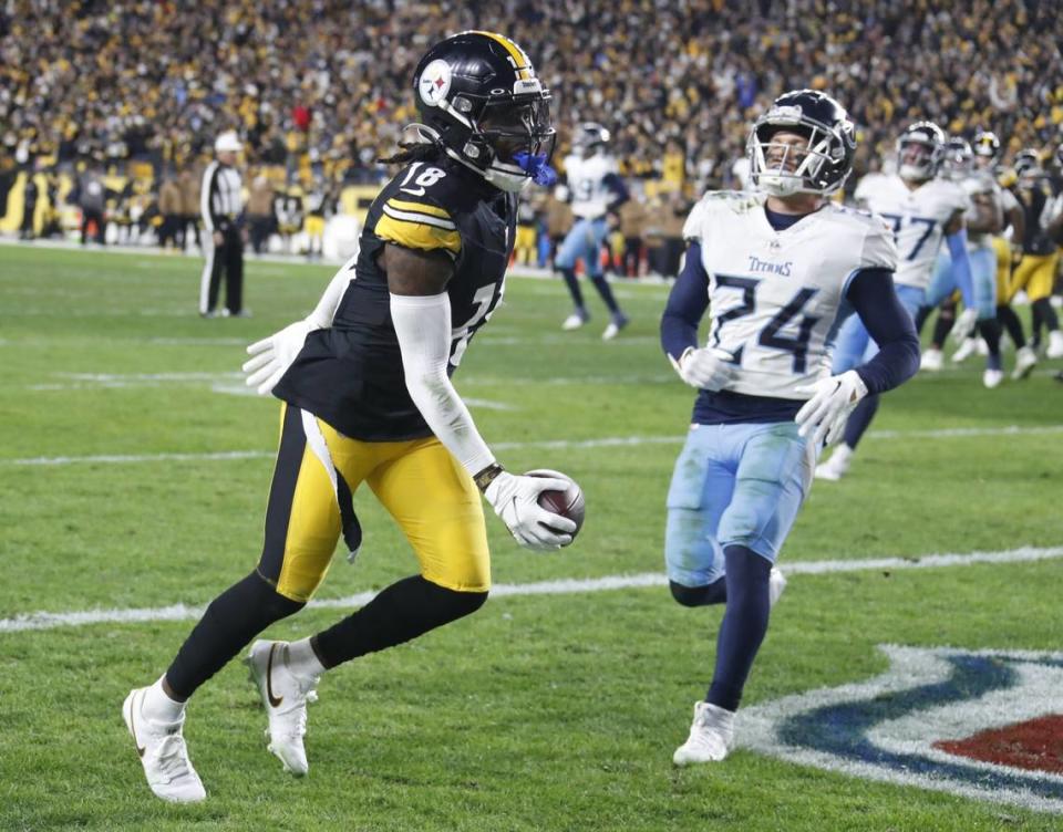 Nov 2, 2023; Pittsburgh, Pennsylvania, USA; Pittsburgh Steelers wide receiver Diontae Johnson (18) makes the game winning touchdown against Tennessee Titans cornerback Elijah Molden (24) during the fourth quarter at Acrisure Stadium. Pittsburgh won 20-16. Mandatory Credit: Charles LeClaire-USA TODAY Sports