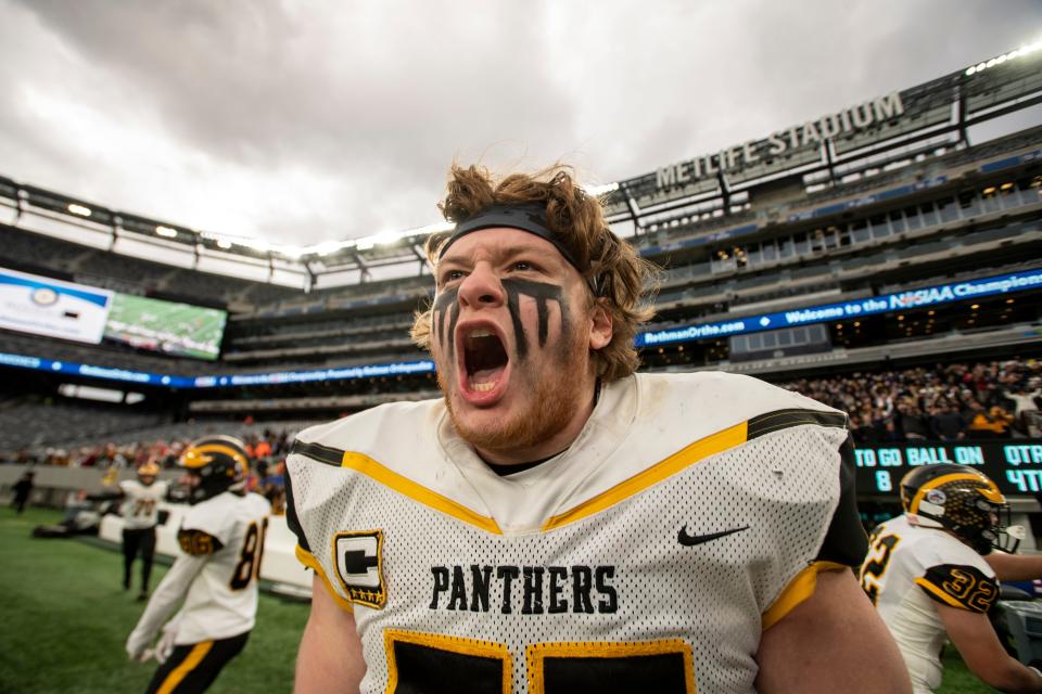 Cedar Grove #77 Nick Christiano celebrates as his team closes in on defeating Park Ridge in the North Group 1 regional championship gameÊat MetLife Stadium on Friday, November 26, 2021. 