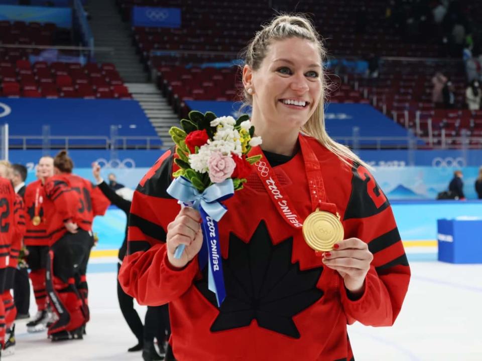 Forward Natalie Spooner, seen above celebrating Olympic gold in 2022, was among 23 players named to Team Canada for the women's hockey world championship in April. (Bruce Bennett/Getty Images - image credit)