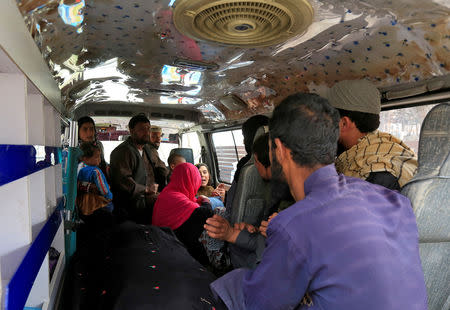 A family reacts inside an ambulance after they lost a family member after multiple explosions in Kabul, Afghanistan, March 21, 2019. REUTERS/Parwiz