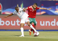Morocco's Hakim Ziyach, right, and Namibia's Riaan Hanamub fight for the ball during the African Cup of Nations group D soccer match between Morocco and Namibia in Al Salam Stadium in Cairo, Egypt, Sunday, June 23, 2019. (AP Photo/Ariel Schalit)