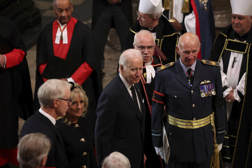 U.S. President Joe Biden and first lady Jill Biden arrive at the Westminster Abbey on the day of Queen Elizabeth II funeral, in London Monday, Sept. 19, 2022. (Phil Noble/Pool Photo via AP)