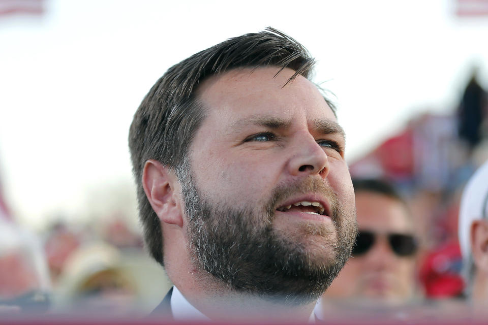 FILE - Republican Senate candidate JD Vance listens to former President Donald Trump at a rally on April 23, 2022, in Delaware, Ohio. Vance is seeking the Republican nomination for the U.S. Senate seat. (AP Photo/Joe Maiorana, File)