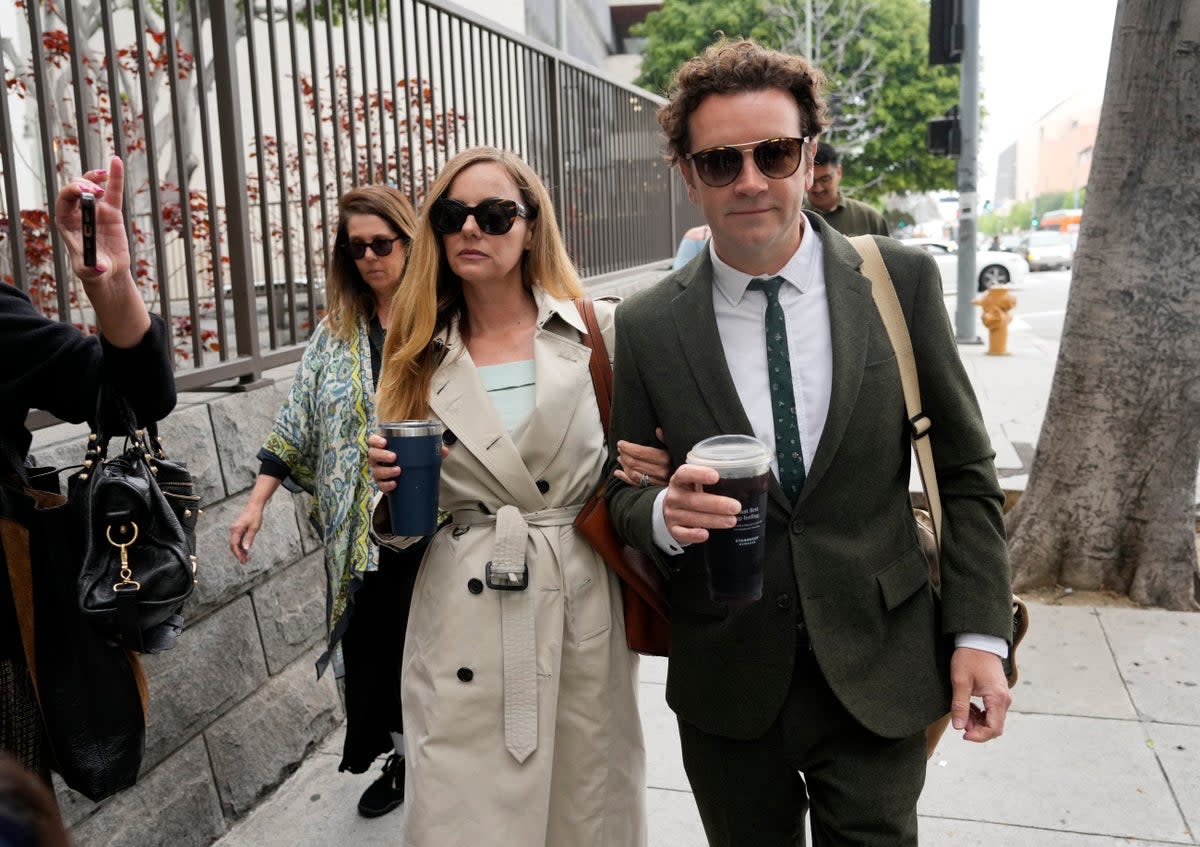 Danny Masterson and his wife Bijou Phillips arrive at court in Los Angeles (AP)