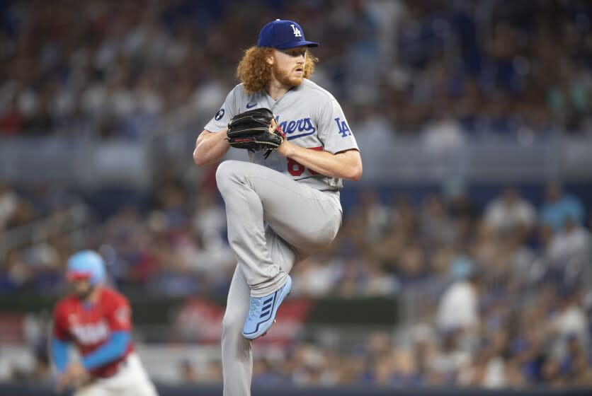 Los Angeles Dodgers starting pitcher Dustin May winds up to deliver.