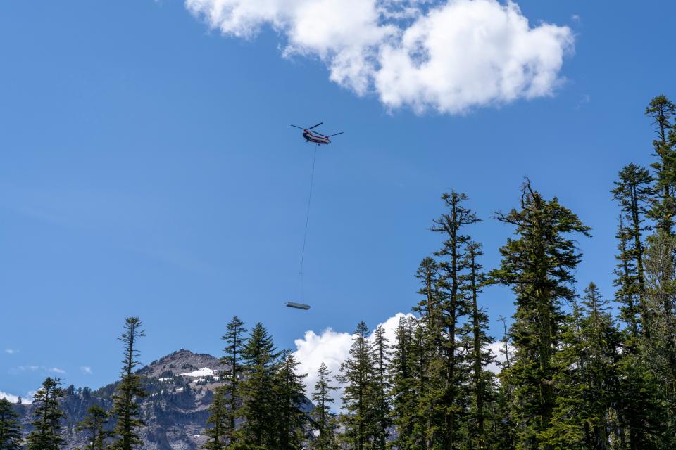 Delivered by helicopter, tour boats built for the deepest lake in America arrived June 26 at Crater Lake National Park.
