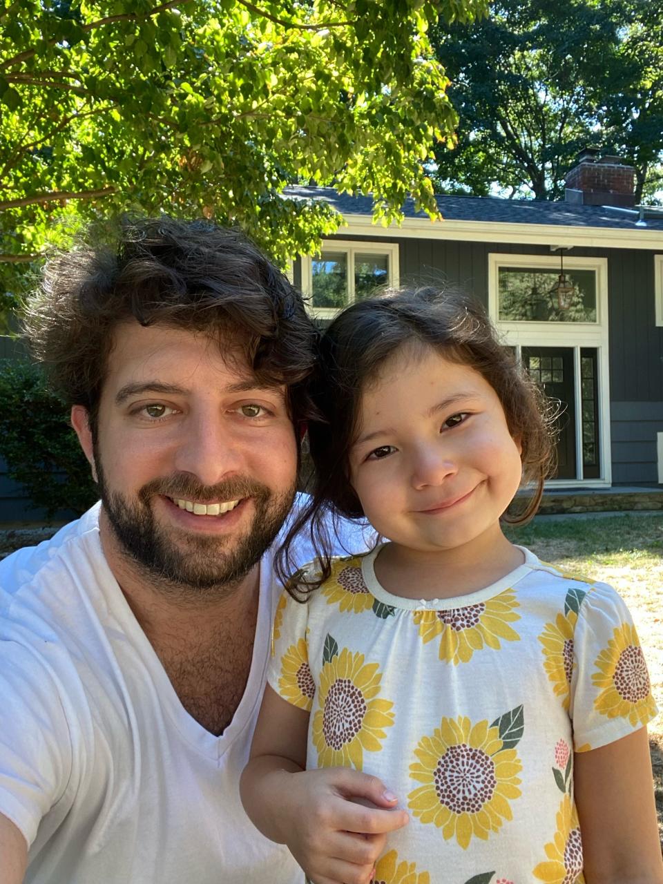 Scott Golub and his daughter, Sophie, outside their new home in Pleasantville, N.Y.